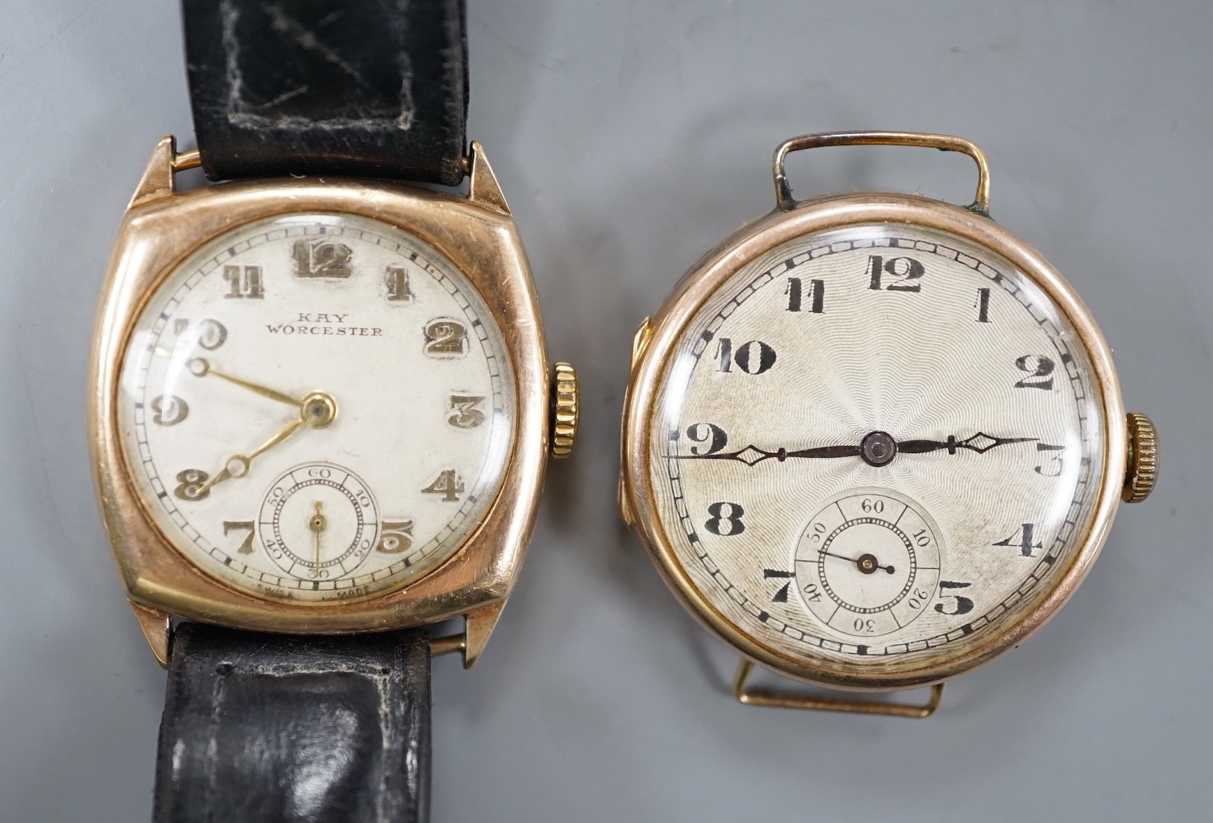 A gentleman's 1930's 9ct gold manual wind wrist watch (no strap), with case back inscription and one other gentleman's yellow metal manual wind wrist watch.